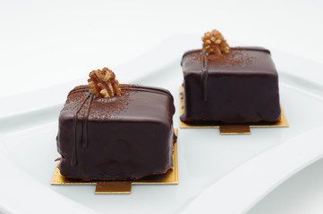 Chocolate sponge cakes on white plate