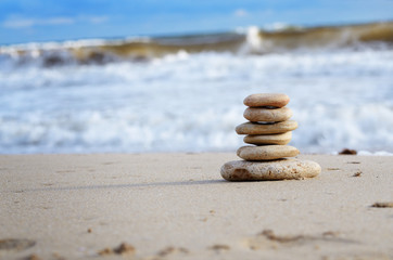 Fototapeta na wymiar Stack of pebbles at the sea coast