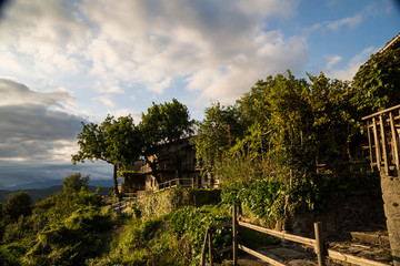 sunset between clouds on italian countryside