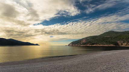 Sunset at Bussaglia beach near Porto in Corsica