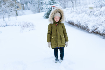Fototapeta na wymiar Little girl outdoors on winter