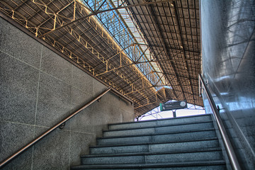 Fototapeta premium Stairs of a train station platform in