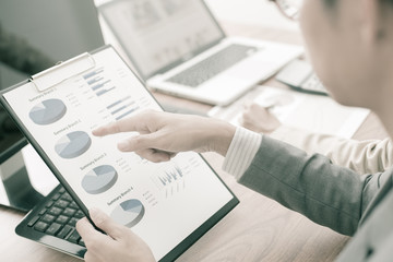 Business people discussing the charts and graphs showing the res