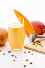 Fototapeta premium Decorated Mango Milk Shake And Crushed Cardamon