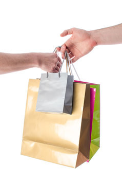 Hand giving shopping bags