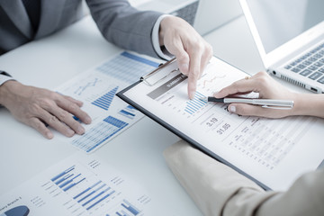 Business people discussing the charts and graphs showing the res