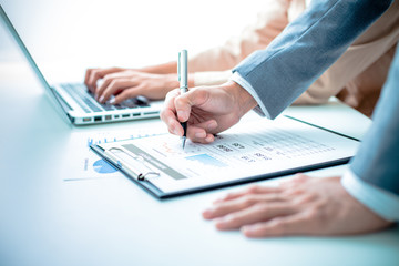 Business people discussing the charts and graphs showing the res