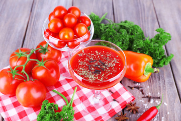 Tomato juice in goblet and fresh vegetables
