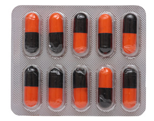 Pills in blister pack closeup isolated on a white background