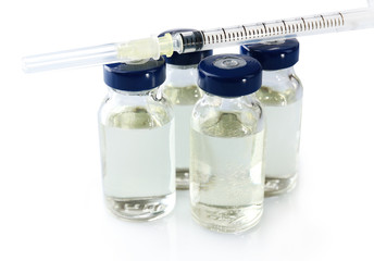 Vaccine in vial with syringe