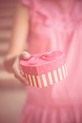 Woman hands holding a gift