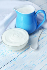 Dairy products on wooden table background