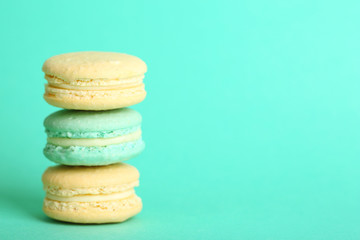 Gentle colorful macaroons on color background