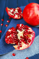 Juicy ripe pomegranates on wooden table
