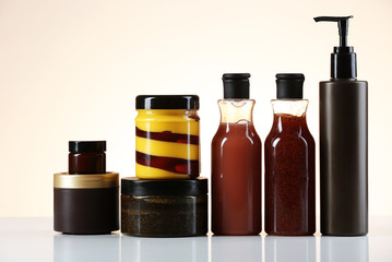 Cosmetic bottles on light background