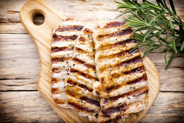 Grilled pork chops pieces. Spices and rosemary.