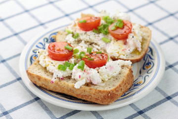 Cottage cheese with radish, chives and cherry tomatoes.