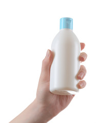 Female hand with cosmetics bottle isolated on white