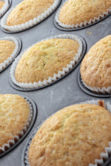Baked vanila cupcakes sprinkled with white sugar.