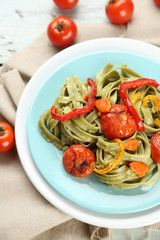 Tasty pasta with pepper, carrot and tomatoes