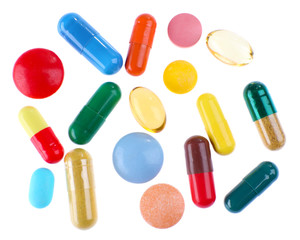 Different colorful pills isolated on white background