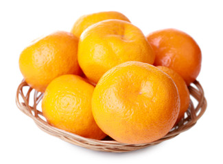 Tangerines in basket isolated on white