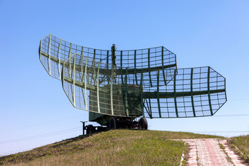 Military russian radar station against blue sky