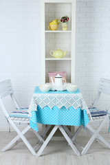 Wooden chairs and table in cozy kitchen