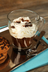 Cup of coffee with cream and cookies