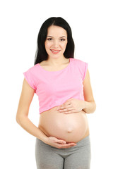 Beautiful young pregnant woman touching her belly isolated