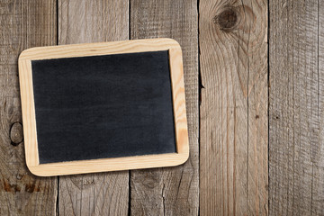 Empty blackboard on wooden background