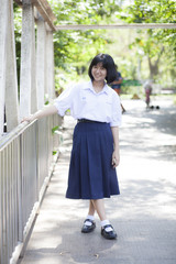 Asian schoolgirl smiling.