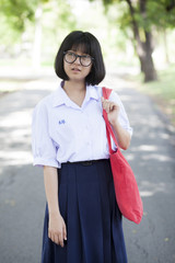 Schoolgirl. Red carrying bag