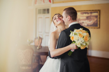 Bride and groom dancing the hall