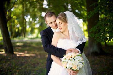 Elegant bride and groom posing together