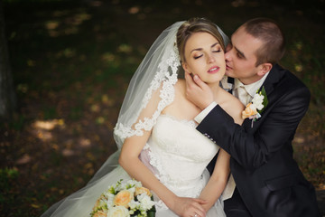 Elegant bride and groom posing together