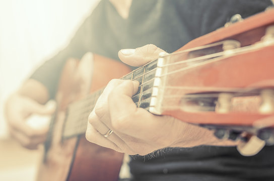 Man playing guitar.