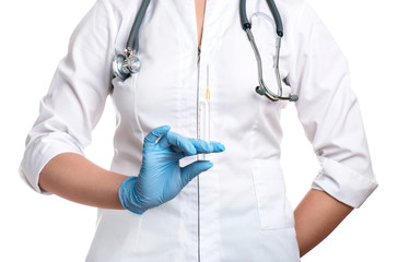Doctor holding medical injection syringe and stethoscope, isolat