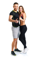 Athletic man and woman after fitness exercise with a finger up o