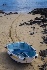 Boat on the sand in the Old town harbor harbour Corralejo Fuerte