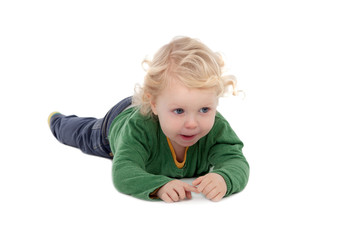 Adorable blond baby lying on the floor