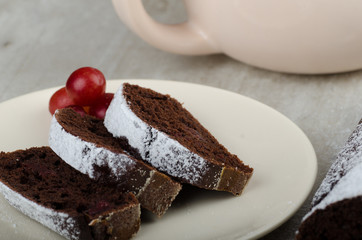 Chocolate cake with strawberries and grapes