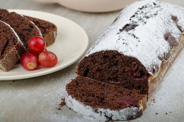 Chocolate cake with strawberries and grapes