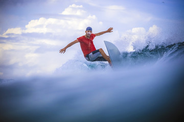 Fototapeta na wymiar Surfer on Amazing Blue Wave
