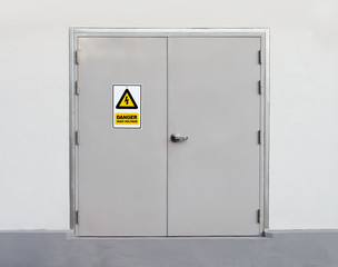 High voltage sign on metal door