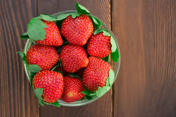 top view bowl of strawberries on wood