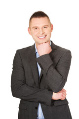 Businessman with hand under chin