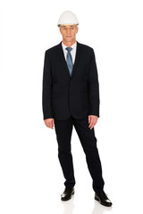 Smiling businessman with hard hat