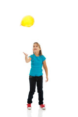 Girl with baloons looking up