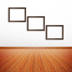 Wooden photo frames on white wall inside the room